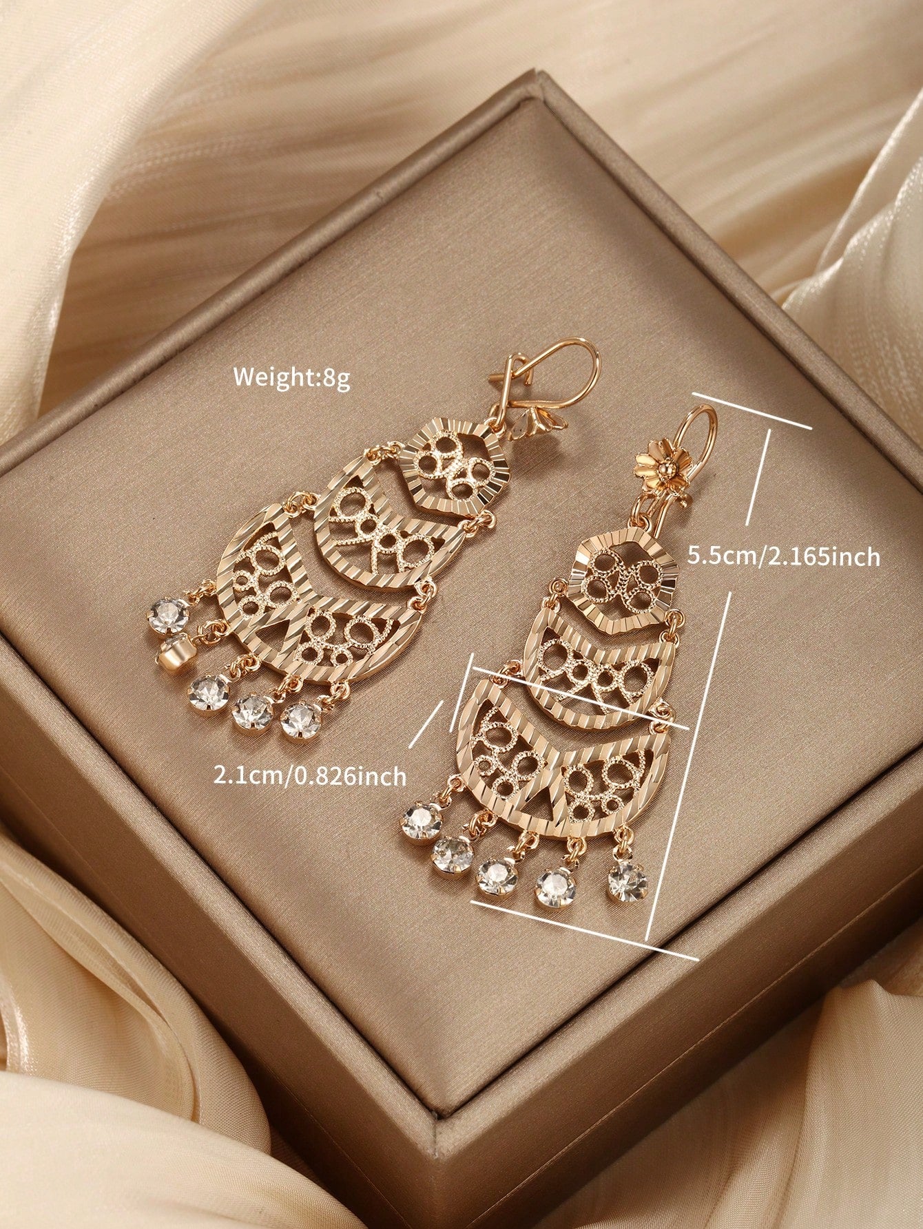 A pair of bohemian style gold-plated copper earrings suitable for ladies to wear at parties