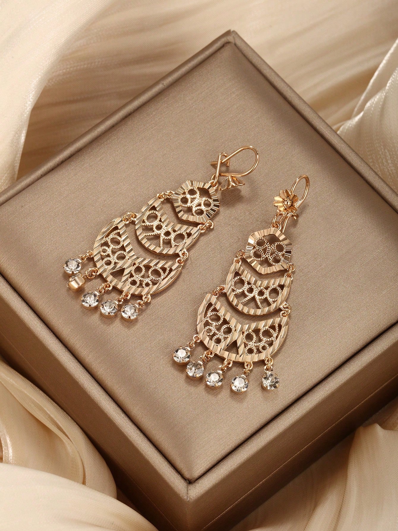 A pair of bohemian style gold-plated copper earrings suitable for ladies to wear at parties