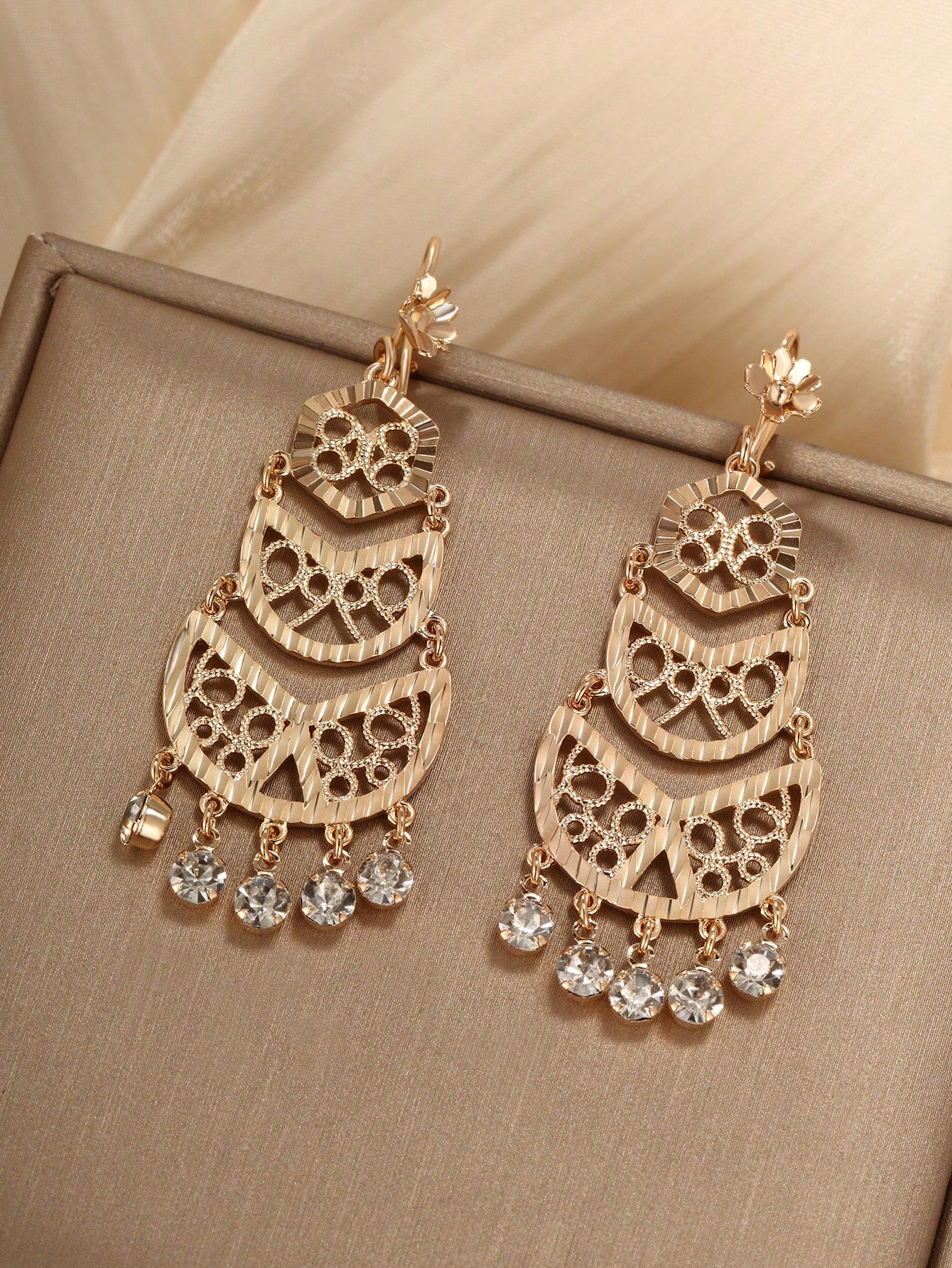 A pair of bohemian style gold-plated copper earrings suitable for ladies to wear at parties